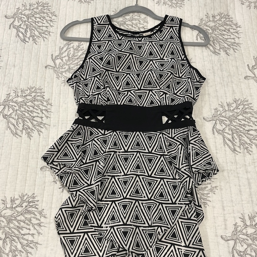 One of a kind sleeveless top that pairs well with anything!